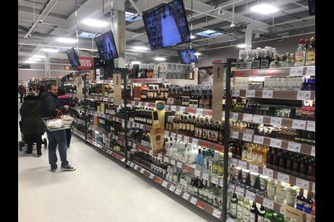 The beers, wines and spirits aisles are much brighter. CCTV screens above the shelves act as a deterrent for theft, but can also broadcast adverts and offers.